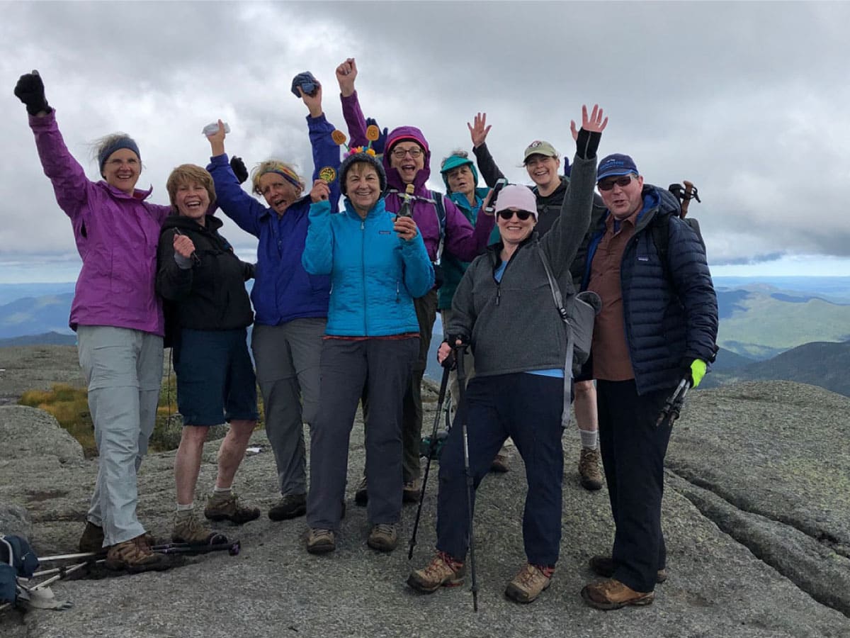 Hikers rejoice at the summit of Iroquois