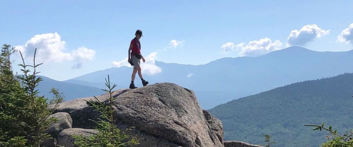 Hiker walking on rocks