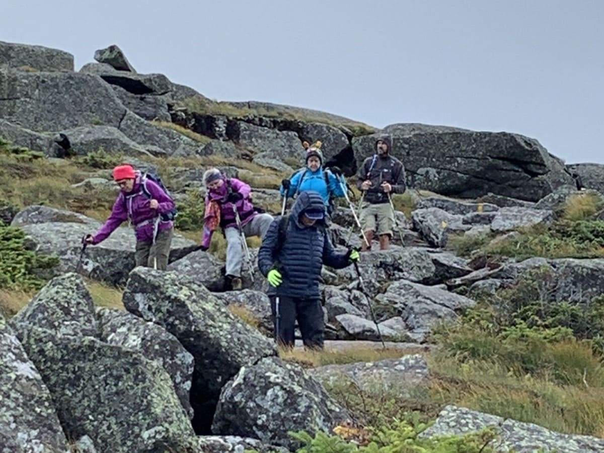 Hikers negotiating boulders