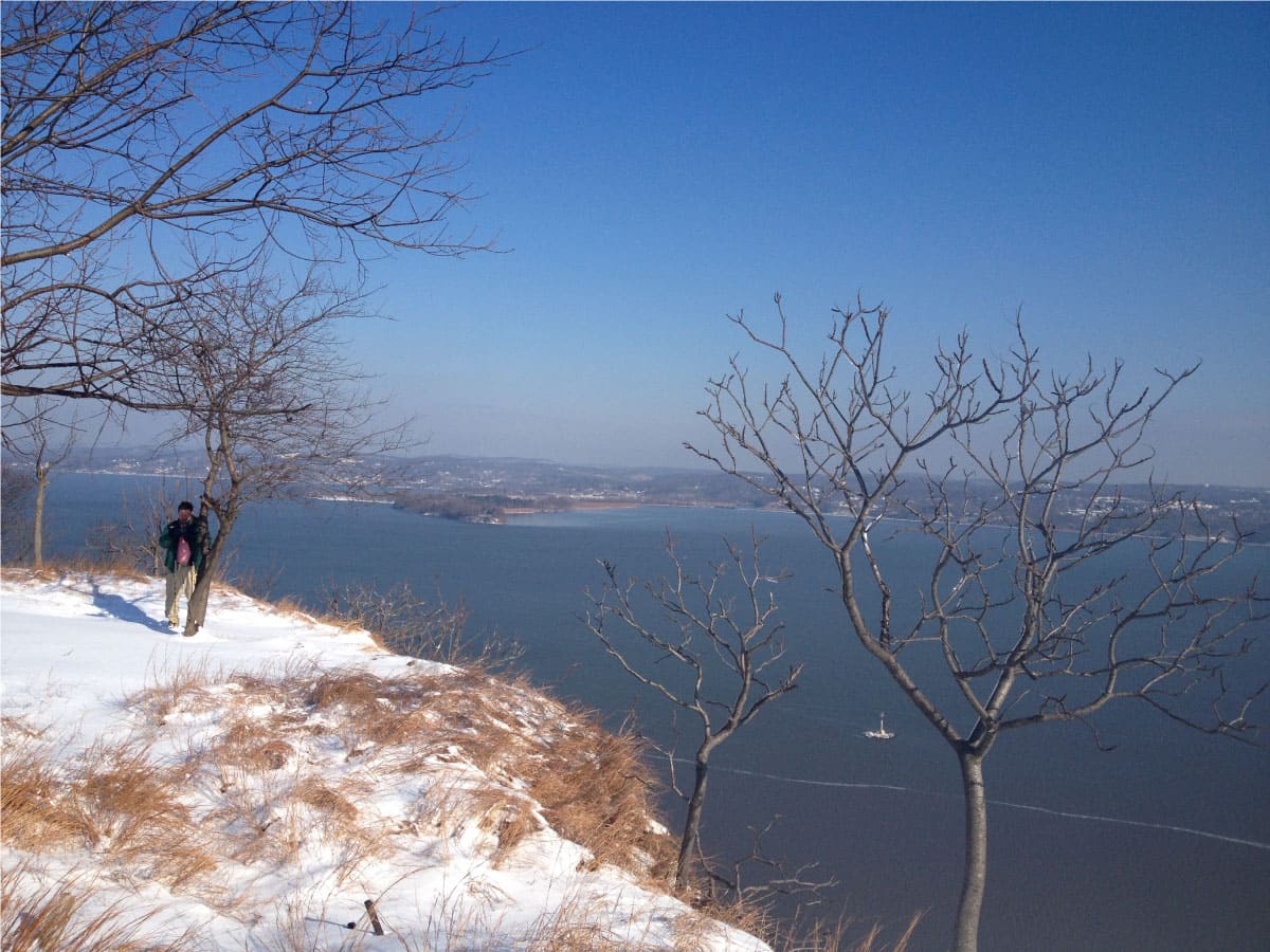 Water view from a snowy hill